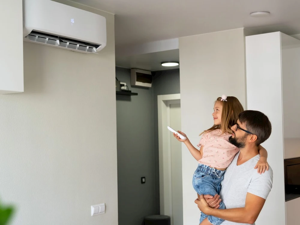 Energy star AC with father and daughter standing