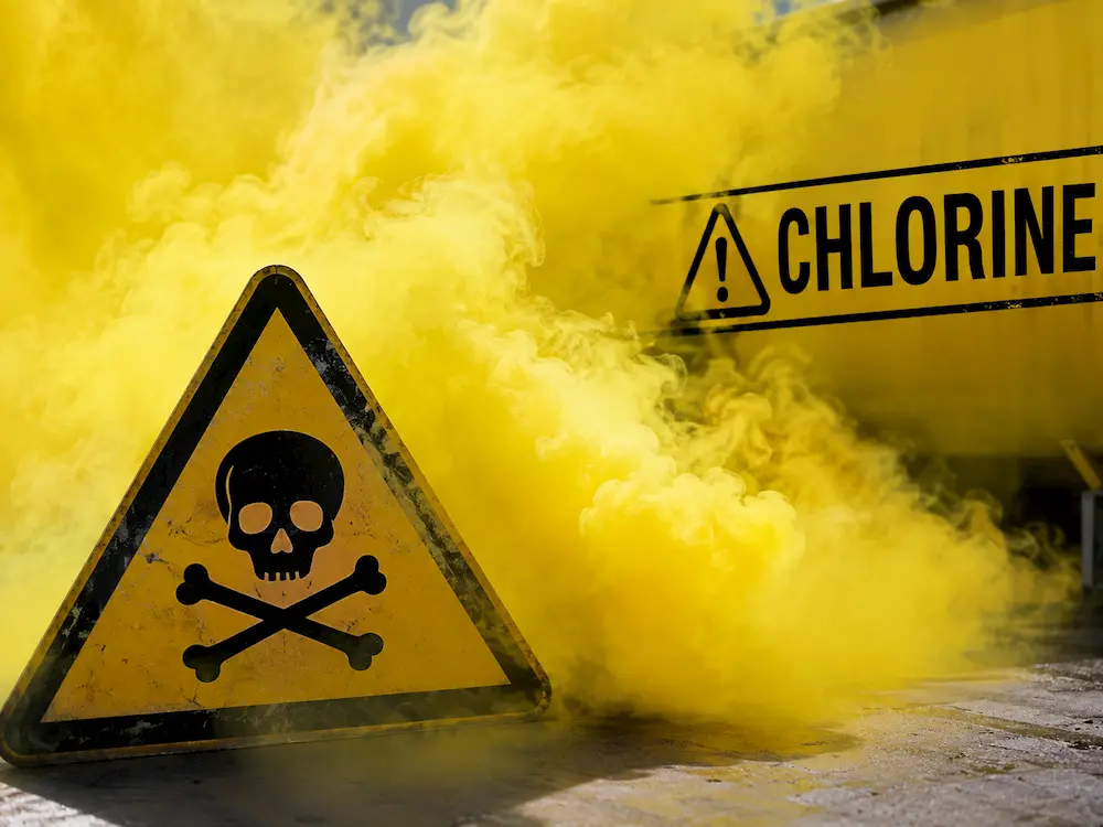 Yellow chlorine gas cloud with safety warning symbols